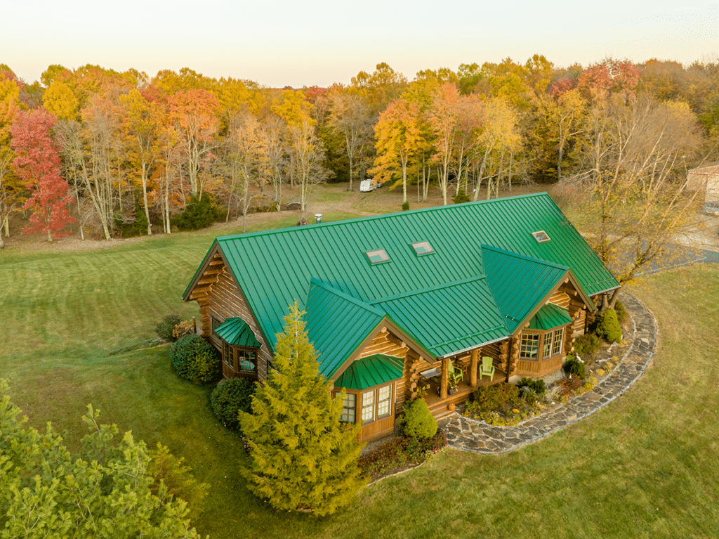 green metal roof on a log cabin