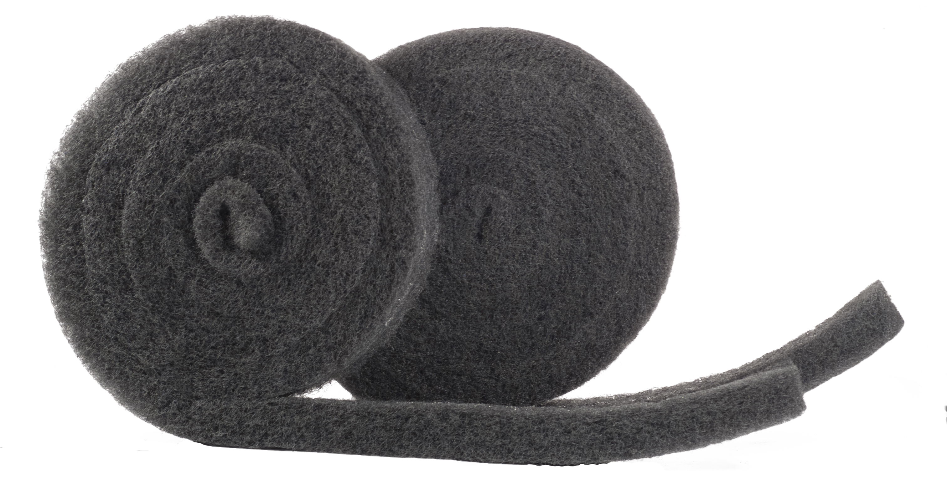 Two rolls of dark gray foam ridge cap ventilation closure strips with a flat unrolled piece showing the material's texture on a white background.