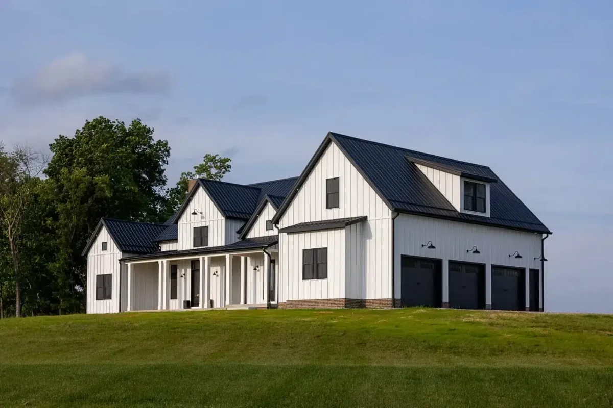 White Metal Sided home on a hill