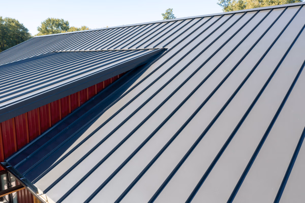 Close-up view of Buckeye metal roofing with vertical ribs and striped panel pattern in gray and blue tones