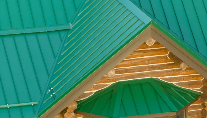 green metal roof on a log cabin