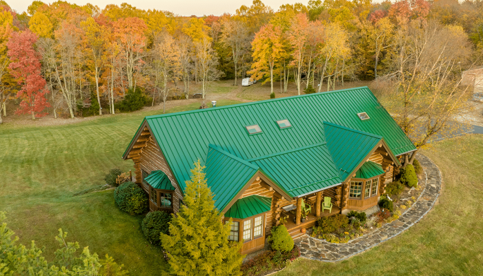 green metal roof on a log cabin